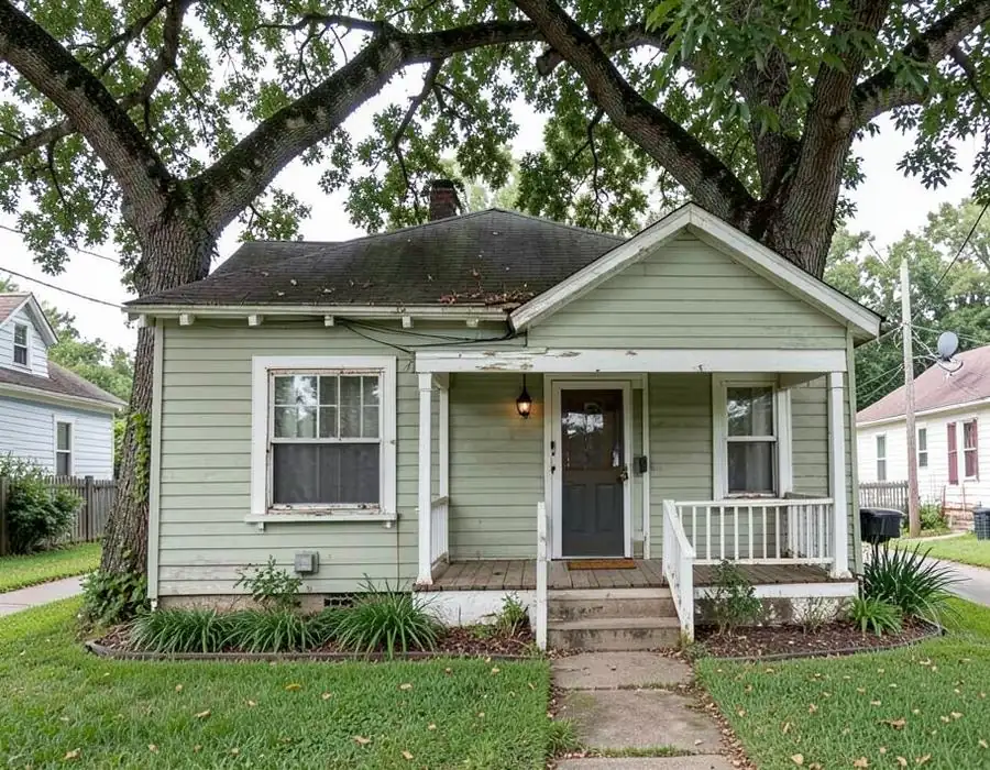 Inherited bungalow under a large tree